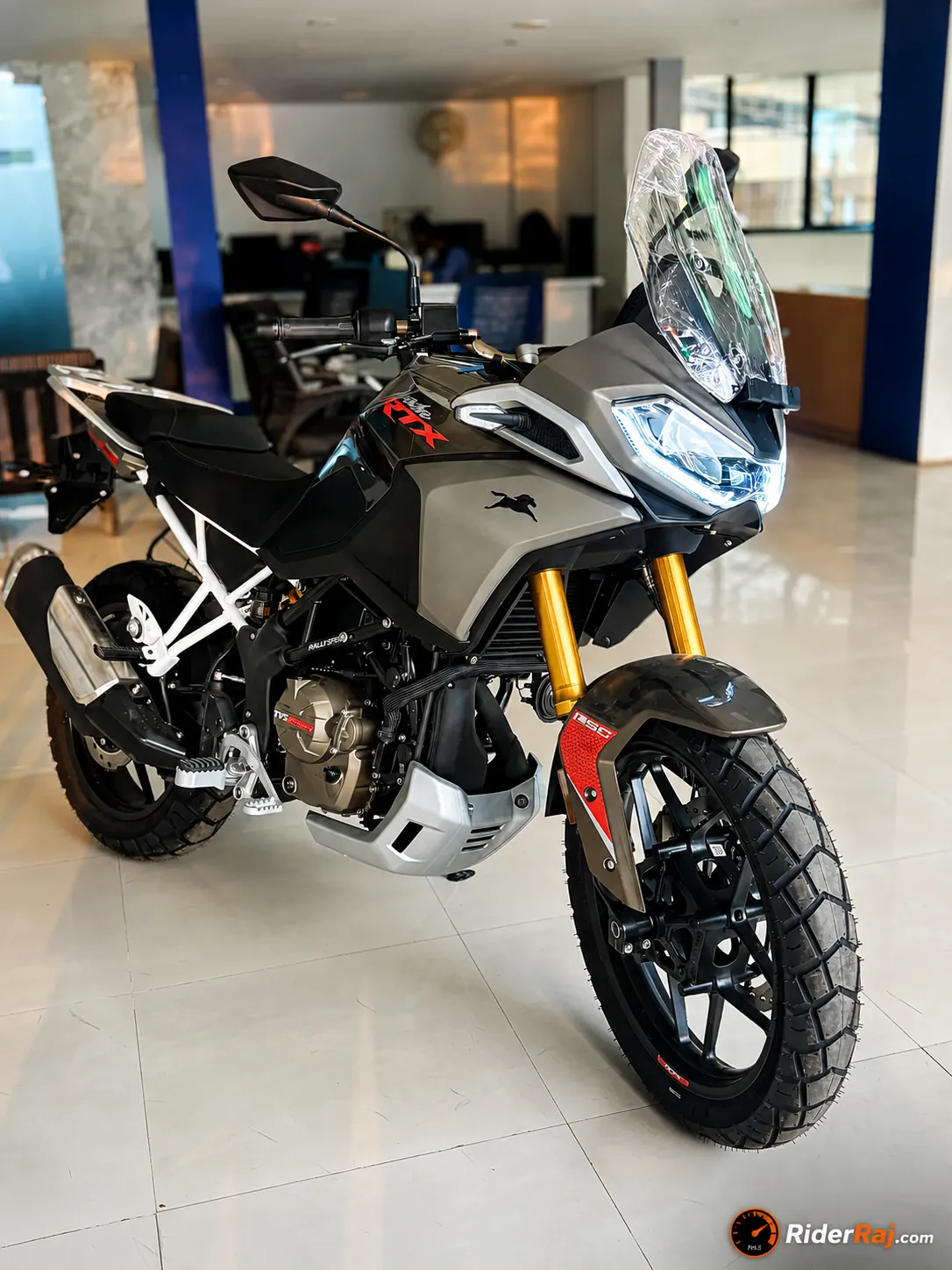 TVS Apache RTX 300 adventure motorcycle front three-quarter view on an open highway