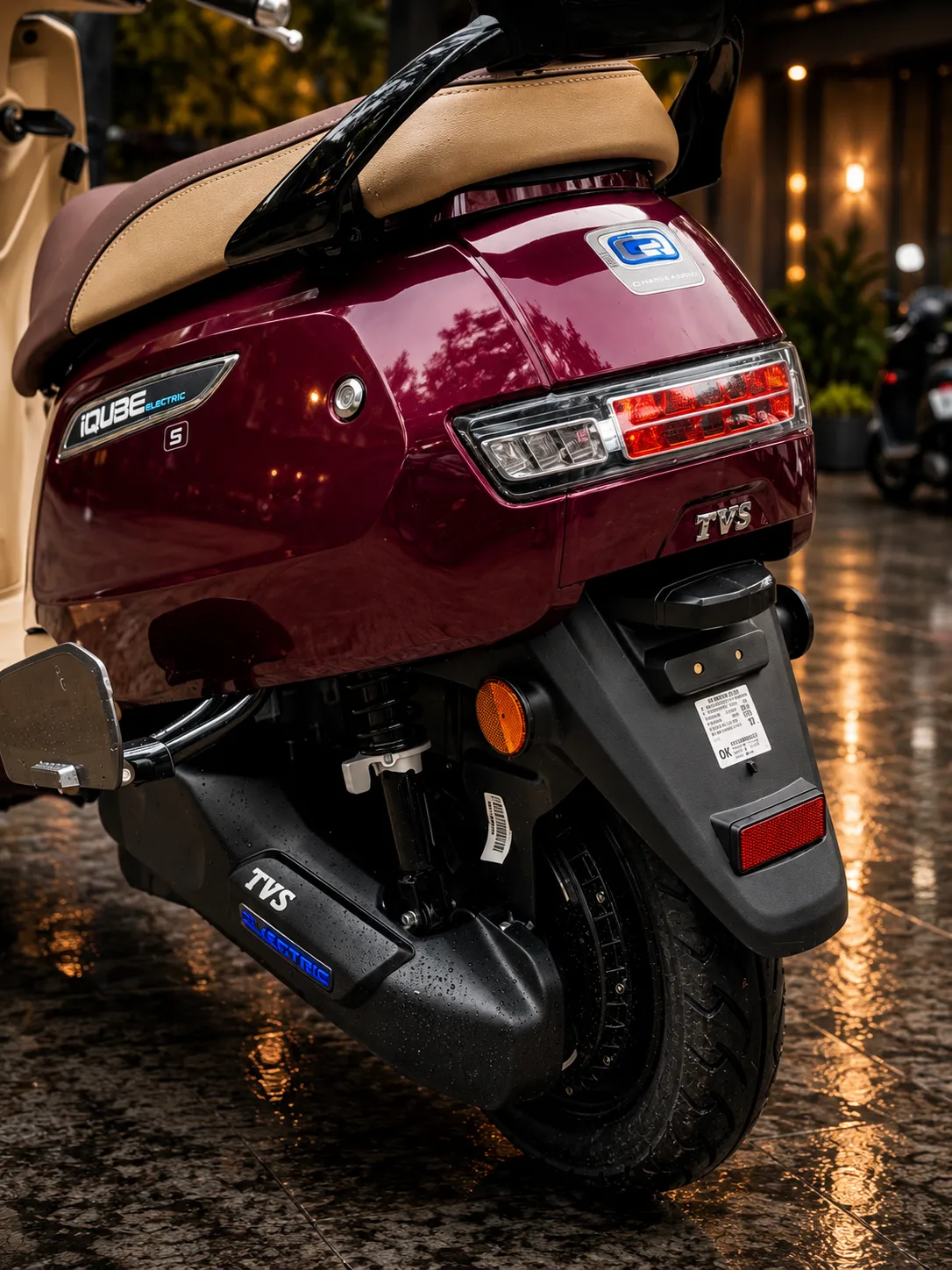 TVS iQube rear view showing pillion seat and tail light