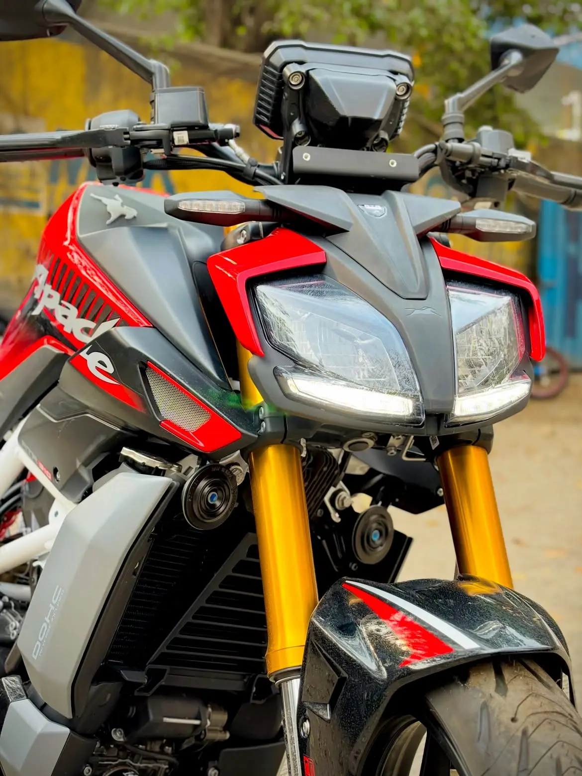 TVS Apache RTR 310 rear three-quarter view showing tail section and exhaust