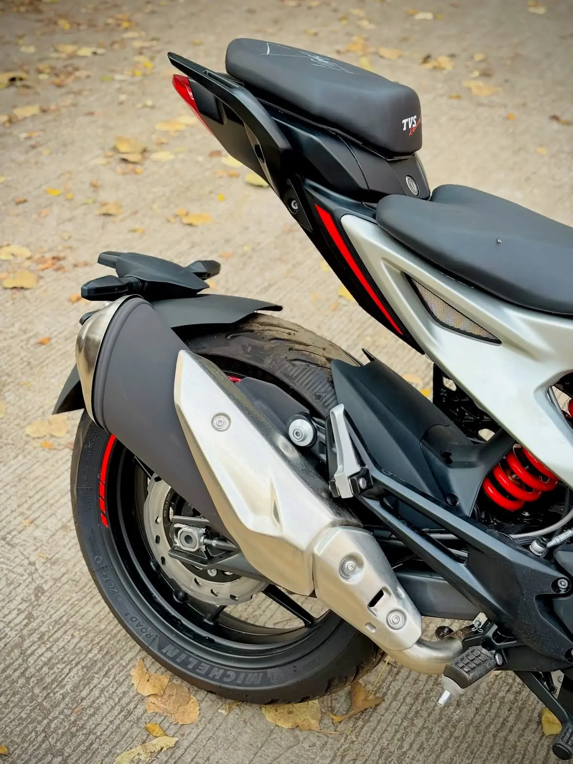 TVS Apache RTR 310 rear three-quarter view showing tail section and exhaust